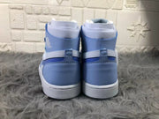 Rear view of the pair showing the blue heel panels, ankle collars, and white midsoles.
