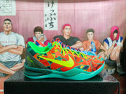 Side view of the orange, lime green, and teal basketball shoe with a Nike Swoosh