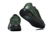 Rear and outsole views of green and black Nike Air Max VERSA sneakers.