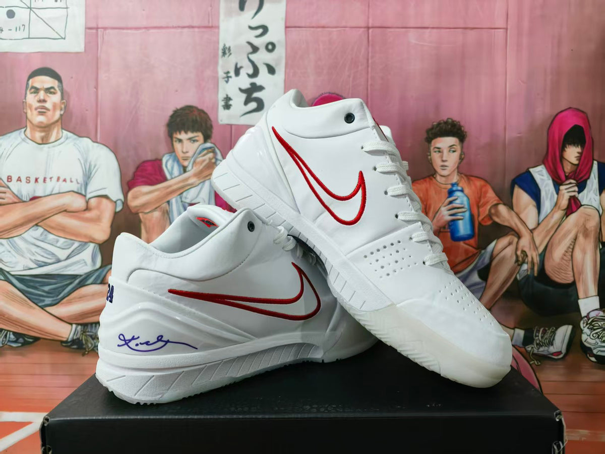 Pair of white basketball sneakers with red Nike swooshes displayed on a box.