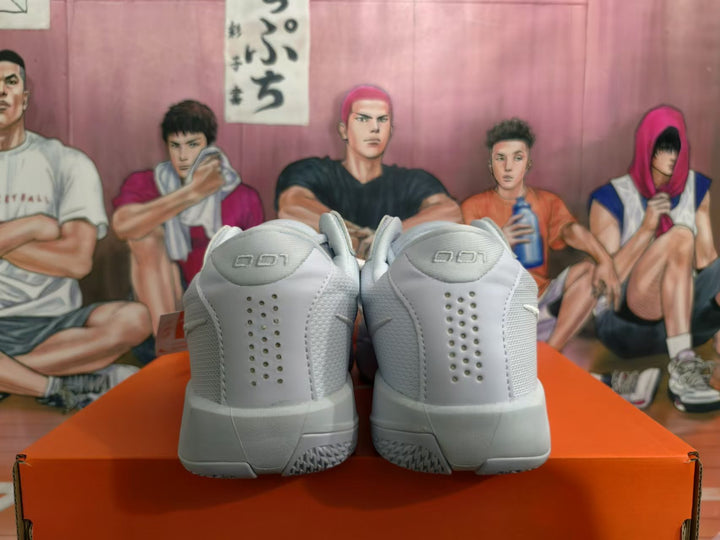 Rear view of white Nike basketball shoes showing perforated heel panels and 101 heel-tab lettering