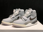 Three-quarter view of the pair showing perforated toes, laces, midfoot straps and padded collars.