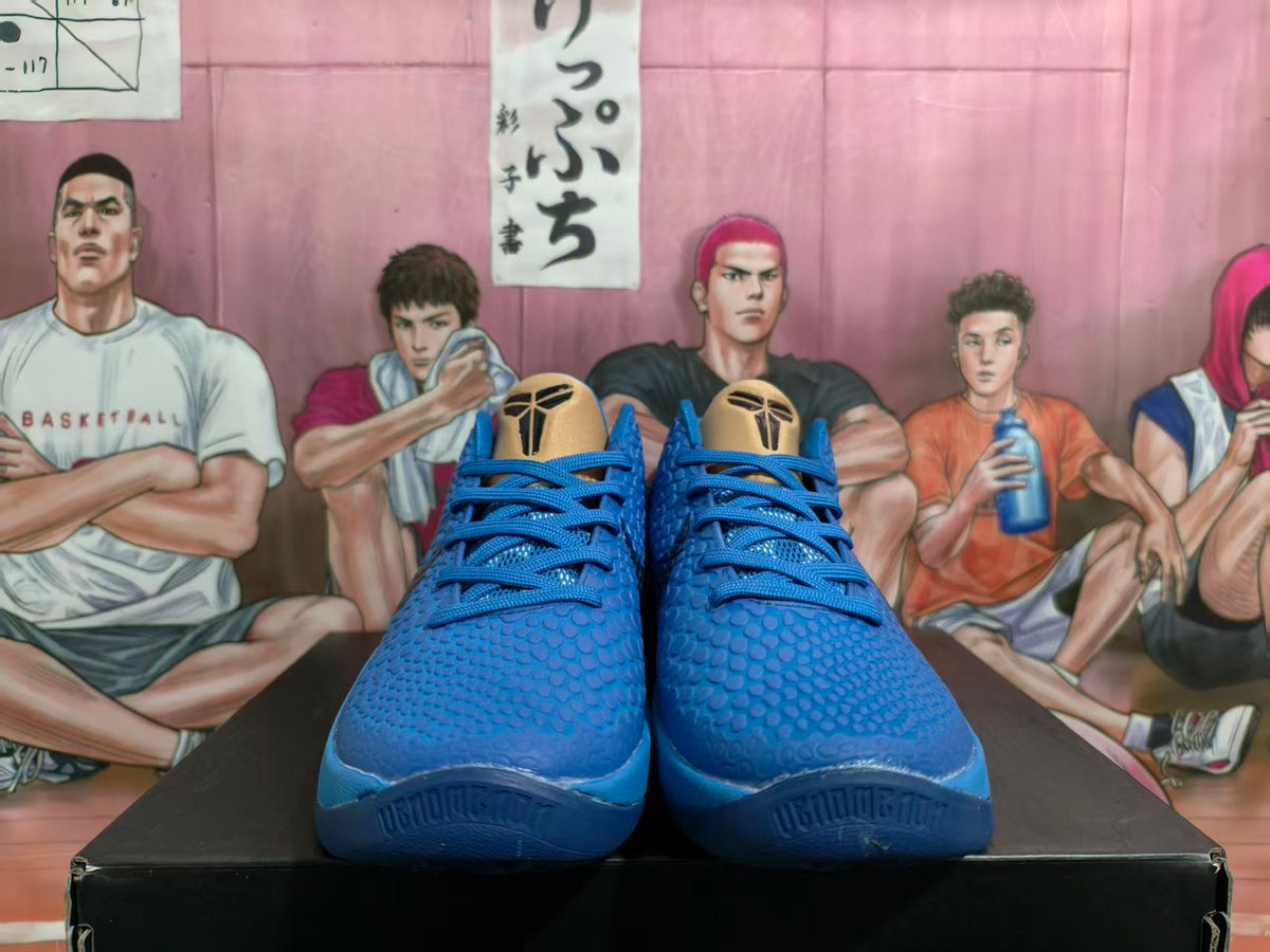 Front view of blue basketball shoes with textured uppers and gold-tone tongue panels