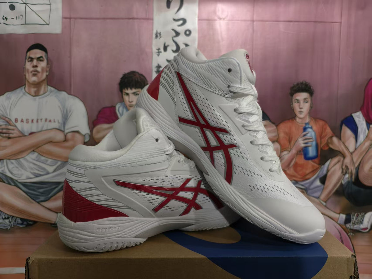 Pair of white and red ASICS basketball sneakers shown from an angled side view