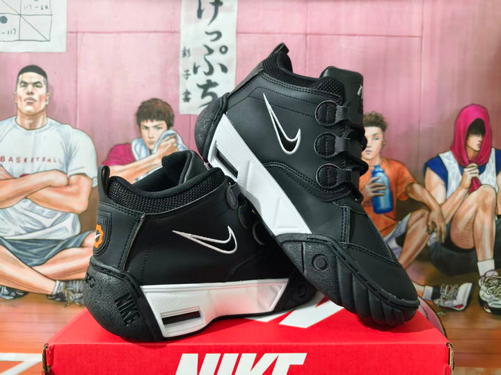 Pair of black and white high-top sneakers shown from the side and at an angle.