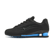 Side profile of black and blue Nike Shox Z R2 sneakers