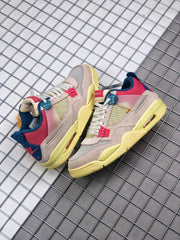 Pair of multicolor Air Jordan 4 sneakers arranged on a metal grid background.