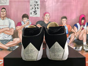 Rear view showing black heel sections and speckled light gray heel panels