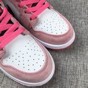 Close-up of the pair's white perforated toe boxes, pink overlays and bright pink laces.