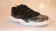 Angled close view of one sneaker showing its lacing structure and reflective dark metallic-look panel.