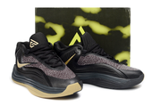 Black and gold Nike Giannis Immortality 7 shoes with a patterned display box