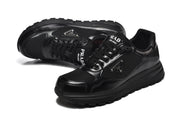 Angled view of black sneakers showing the laces, logo details, and chunky soles