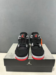 Front view of the pair showing black laces, white lace supports, mesh tongues, and red outsole accents.