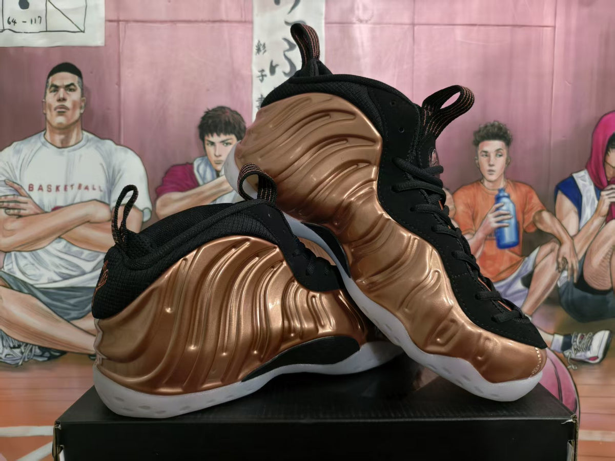 Pair of bronze and black high-top sneakers shown from a three-quarter angle on a black shoebox.