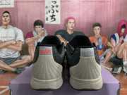 Rear view of gray and black Nike basketball sneakers showing padded collars, stitched heel panels, and off-white midsoles.