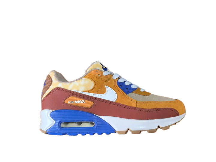 Side view of a multicolor Nike Air Max sneaker in orange, blue, white, tan and reddish brown.