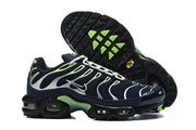 Nike Air Max Plus sneakers showing side profile and outsole with lime-green tread accents.