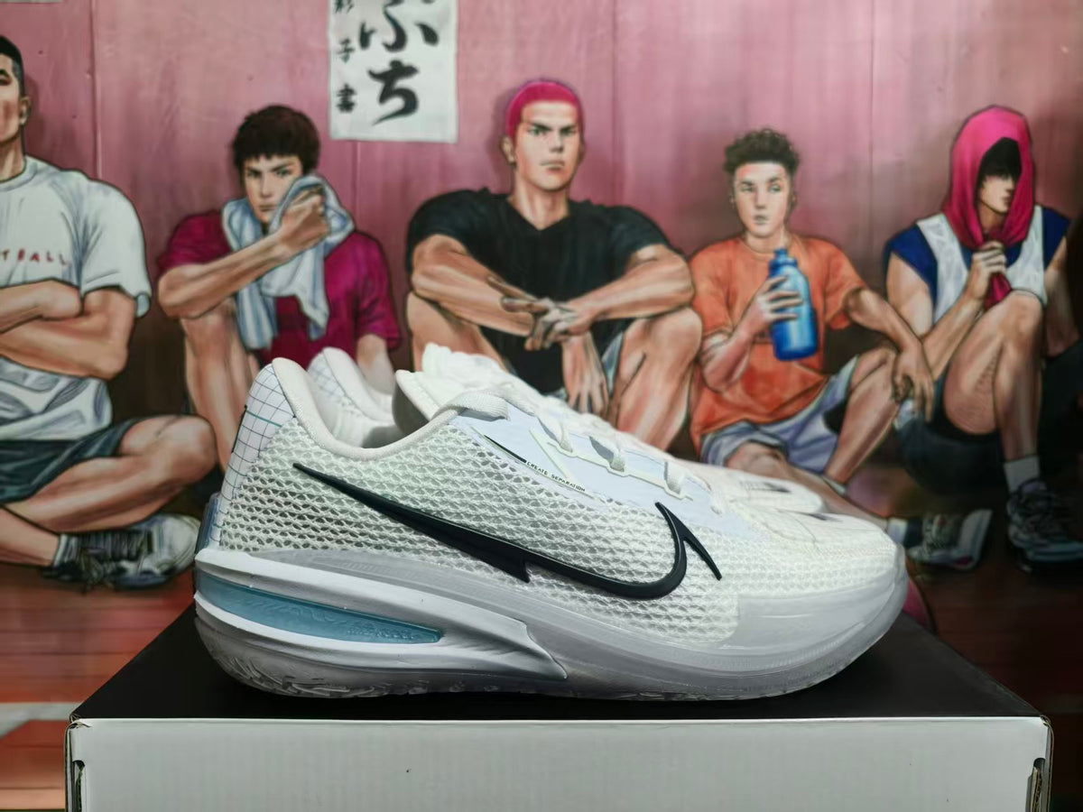 Side view of a white Nike basketball shoe with a black Swoosh and pale blue heel detail.