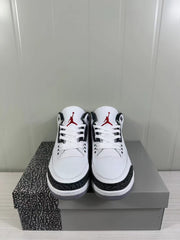 Front view showing white laces, perforated toe boxes, black detailing, and red tongue logos.