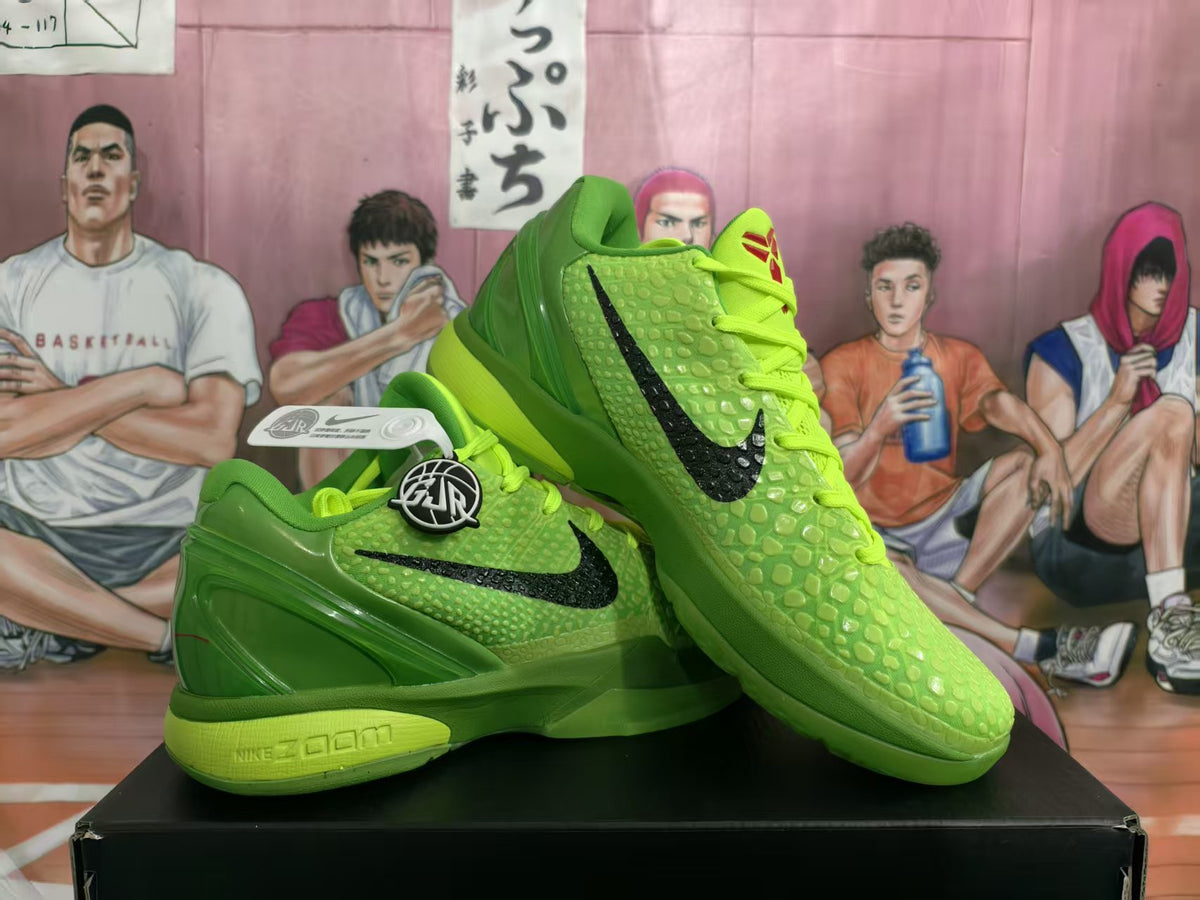 Pair of bright green Nike basketball sneakers with black Swoosh branding, textured uppers, lime laces, and a visible Zoom-marked midsole.