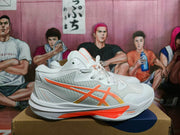 Side view of a white ASICS Sky Elite FF 3 shoe with orange and yellow detailing