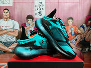 Angled view of aqua and black Under Armour sneakers showing the side logo, black laces, layered upper panels, and dotted outsole pattern.