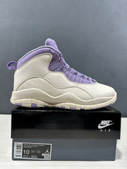 Side view of a white and purple high-top Jordan Air Jordan 10 sneaker displayed on its box; the box label shows size EU 42 and style code IQ0388-101.