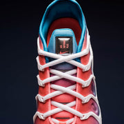 Top-down close-up of the laces and pink-to-blue gradient upper