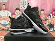 Pair of black high-top basketball sneakers shown from the side, with gold-colored details and white midsoles.