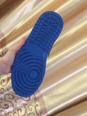 Close-up of the blue rubber outsole showing its circular and segmented tread pattern.
