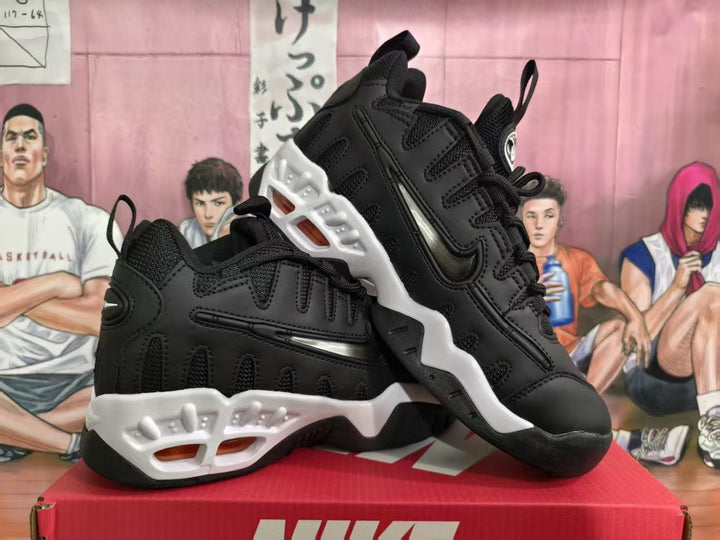 Pair of black Nike sneakers with white sculpted sole details, shown from the side and rear.