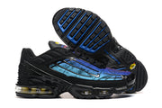 Side and outsole views of black Nike Air Max Plus TN sneakers with blue gradient panels.