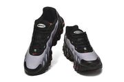 Front views of black and grey Nike Air Max DN8 sneakers with red accents.