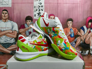Three-quarter view of the colorful Nike basketball sneakers showing the multicolor patterned upper, red Swoosh, white laces, and green outsole.