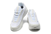 Top and front views of white Nike lace-up sneakers.
