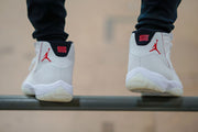Rear three-quarter view of the sneakers being worn.