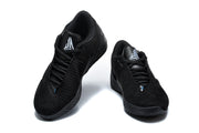 Front and angled views of black low-top sneakers with lace-up fronts