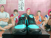 Front view showing perforated turquoise toe panels and black laces