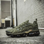 Olive green Nike Air VaporMax Plus TN-8 sneaker photographed outdoors.