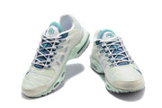 Front view of the pair of white and teal Nike Air Max Tn sneakers.