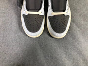 Top view of both sneakers showing perforated black toe boxes surrounded by white panels.