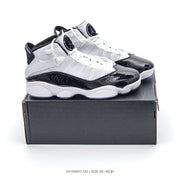 Pair of white, black and purple high-top Jordan-style sneakers displayed on a shoebox; image text shows style code 2411WWYLOG and size range 40–46 with half sizes.