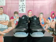 Front view of black lace-up sneakers with translucent outsoles