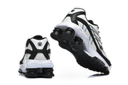 Nike Shox R4 sneakers shown from the rear and underside.