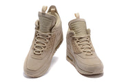 Light beige Nike Air Max 90 Winter sneakerboots shown from the front.