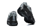 Rear and outsole views of grey and black Nike Air Max 95 sneakers