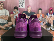 Rear view of the purple Nike basketball sneakers showing the patterned heel panels and textured outsole.