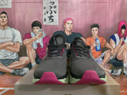Front view of dark On Running sneakers with dotted laces, pink accents, and lime-green soles.
