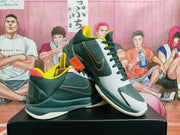 Angled view of the Nike basketball sneakers highlighting the side Swoosh, perforated panels, layered sole, and contrasting color details.
