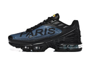 Side view of a black and blue sneaker with Paris lettering, sculpted sole and visible cushioning.